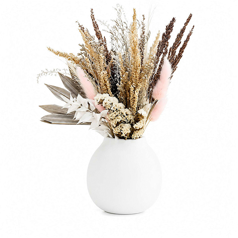 Fleurs sechees dans vase blanc